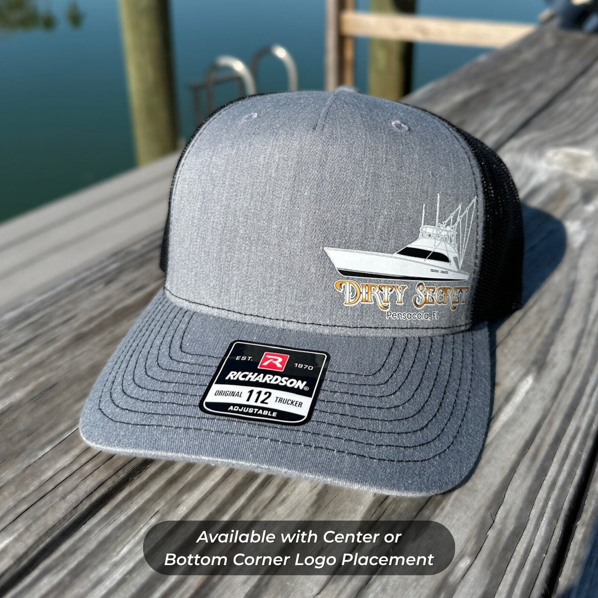Grey/black trucker hat with a custom boat drawing